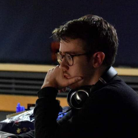 Self Portrait Alex Sermon, Sound Engineer operating Mixer control for a Live Event.